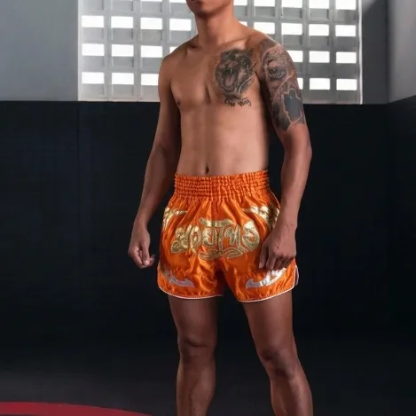 Front of Jiu Jitsu Gears grey microfiber Muay Thai shorts with black trim and Thai script on leg.